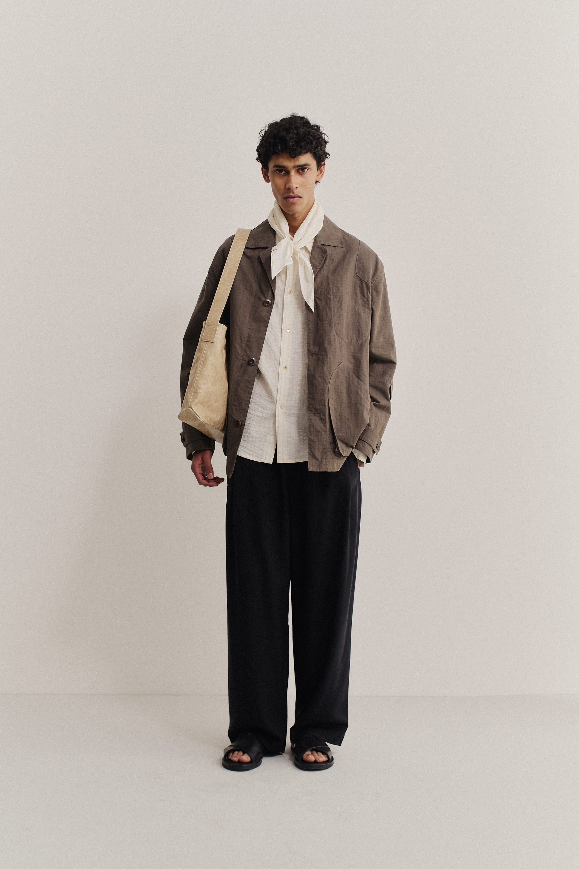 Men's outerwear jacket, cotton blend ripstop, waxed finish, brown, with vintage lapel and patch pockets.