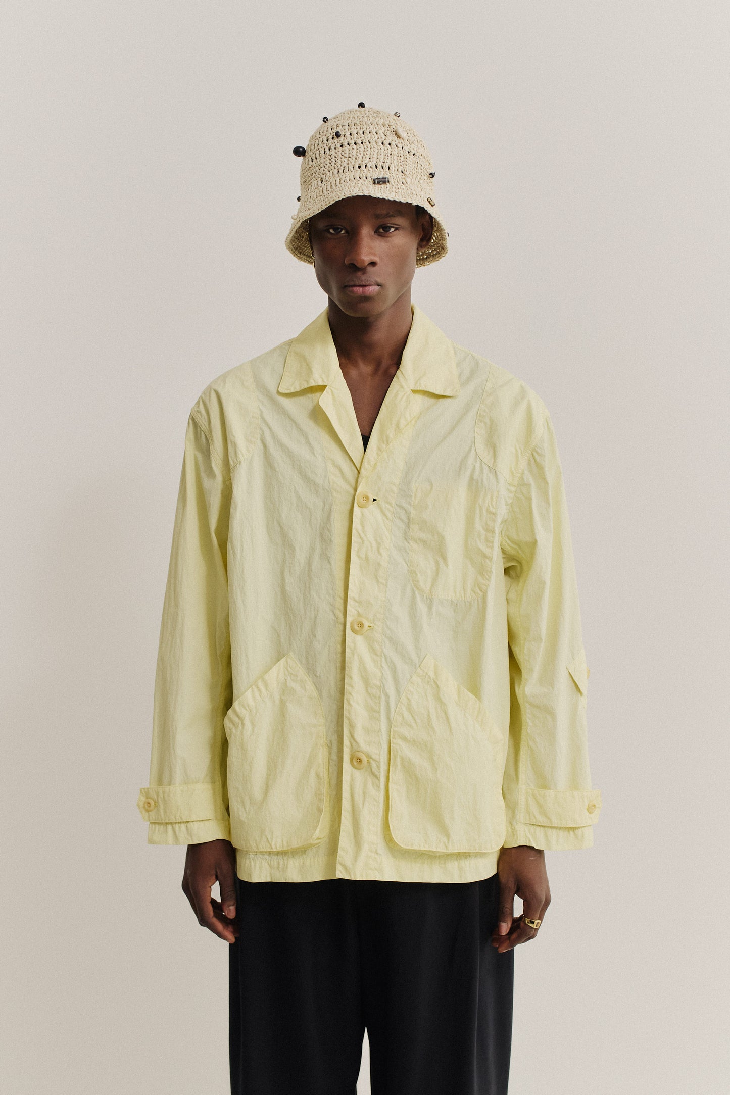 Men's outerwear jacket, recycled polyamide, garment-dyed washed light yellow, vintage-style lapel, patch pockets.