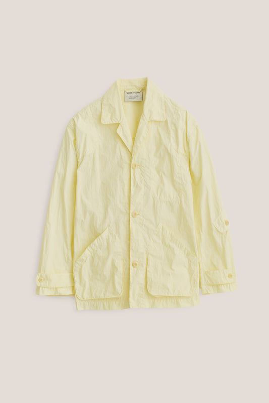 Men's outerwear jacket, recycled polyamide, garment-dyed washed light yellow, vintage-style lapel, patch pockets.