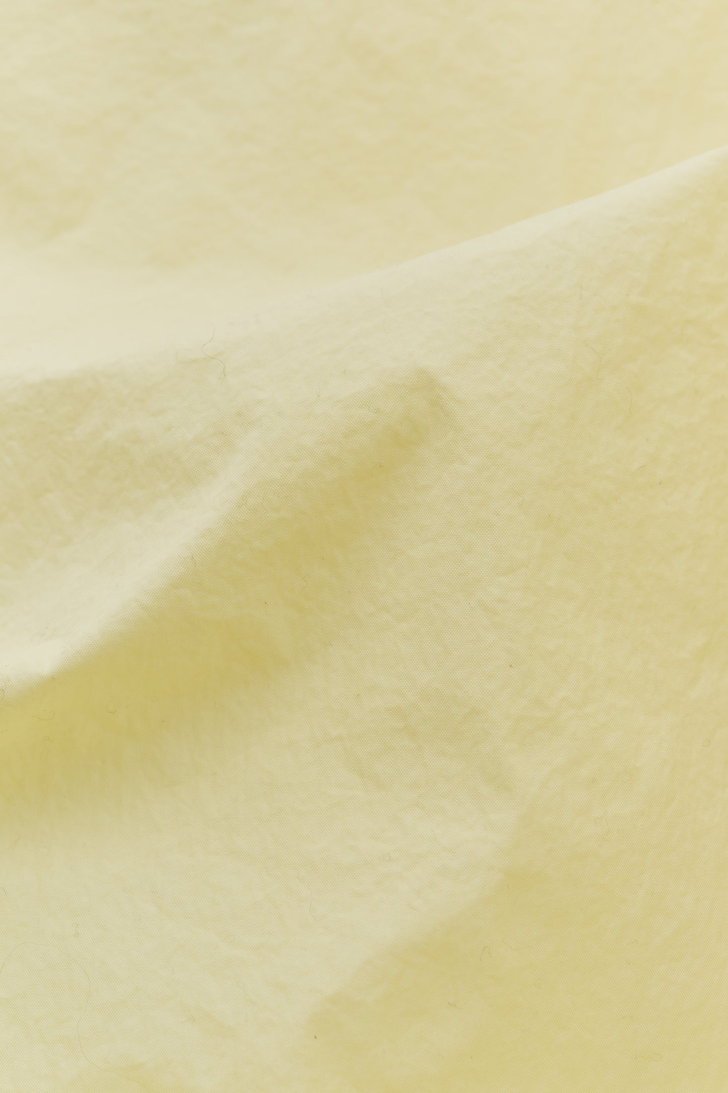 Men's outerwear jacket, recycled polyamide, garment-dyed washed light yellow.