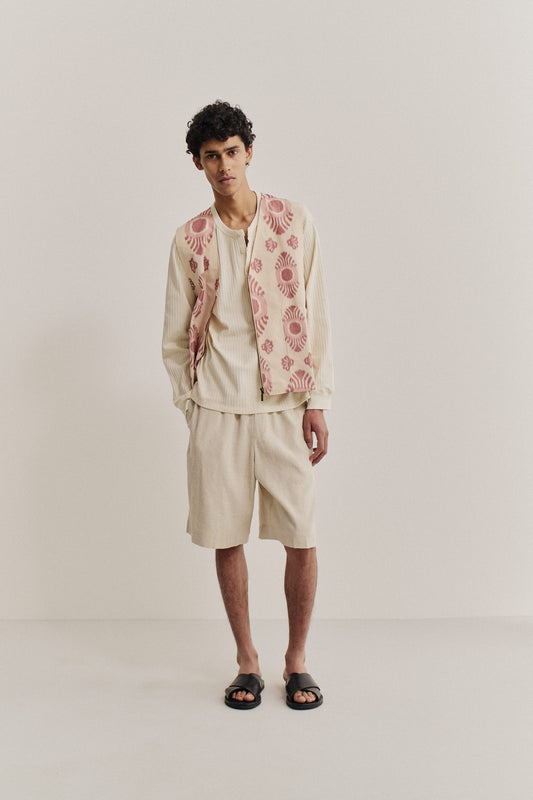 Men's jersey long-sleeved shirt, off-white cotton pointelle, collarless henley with button placket.