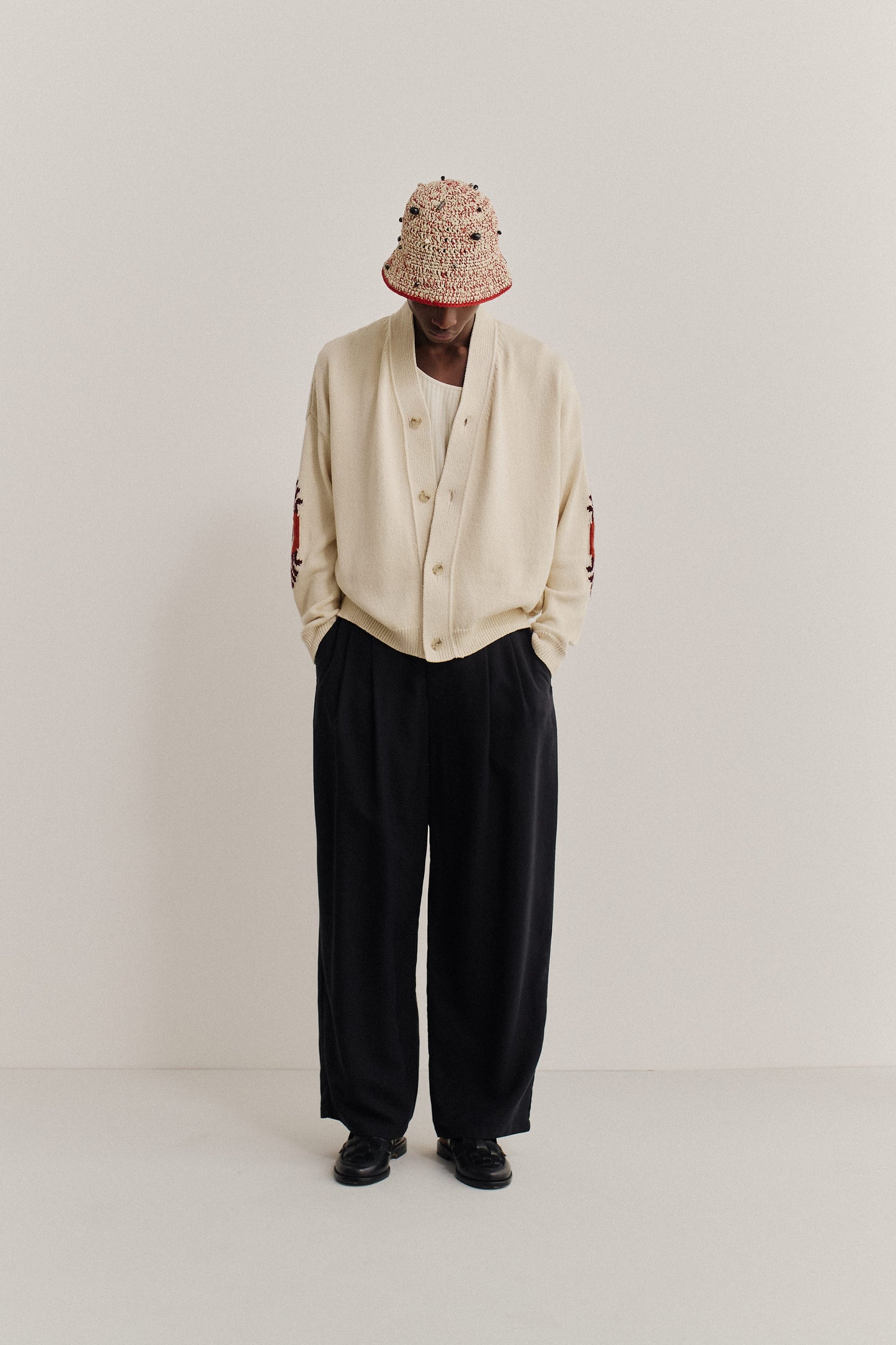 Men's knit cardigan, cotton-cashmere blend, cream, with red embroidered elbow details.