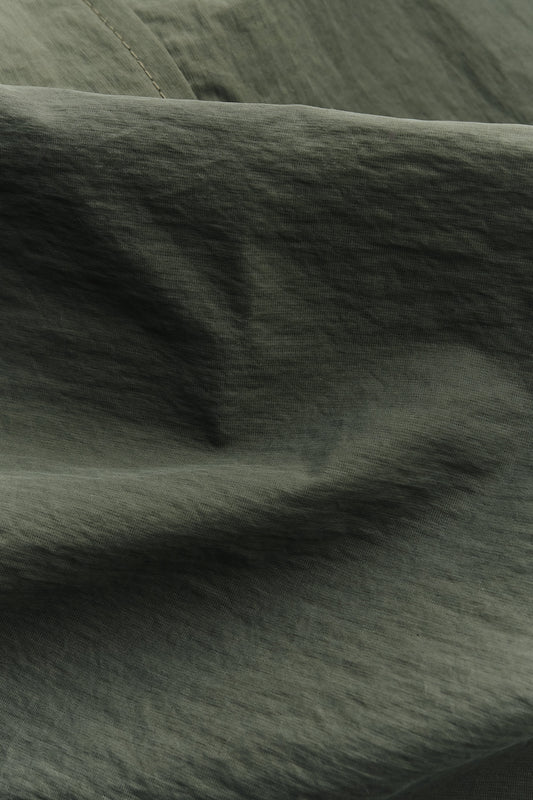 Men's outerwear, oversized Serrara Mac jacket in water-repellent recycled nylon and cotton blend, dark olive green.