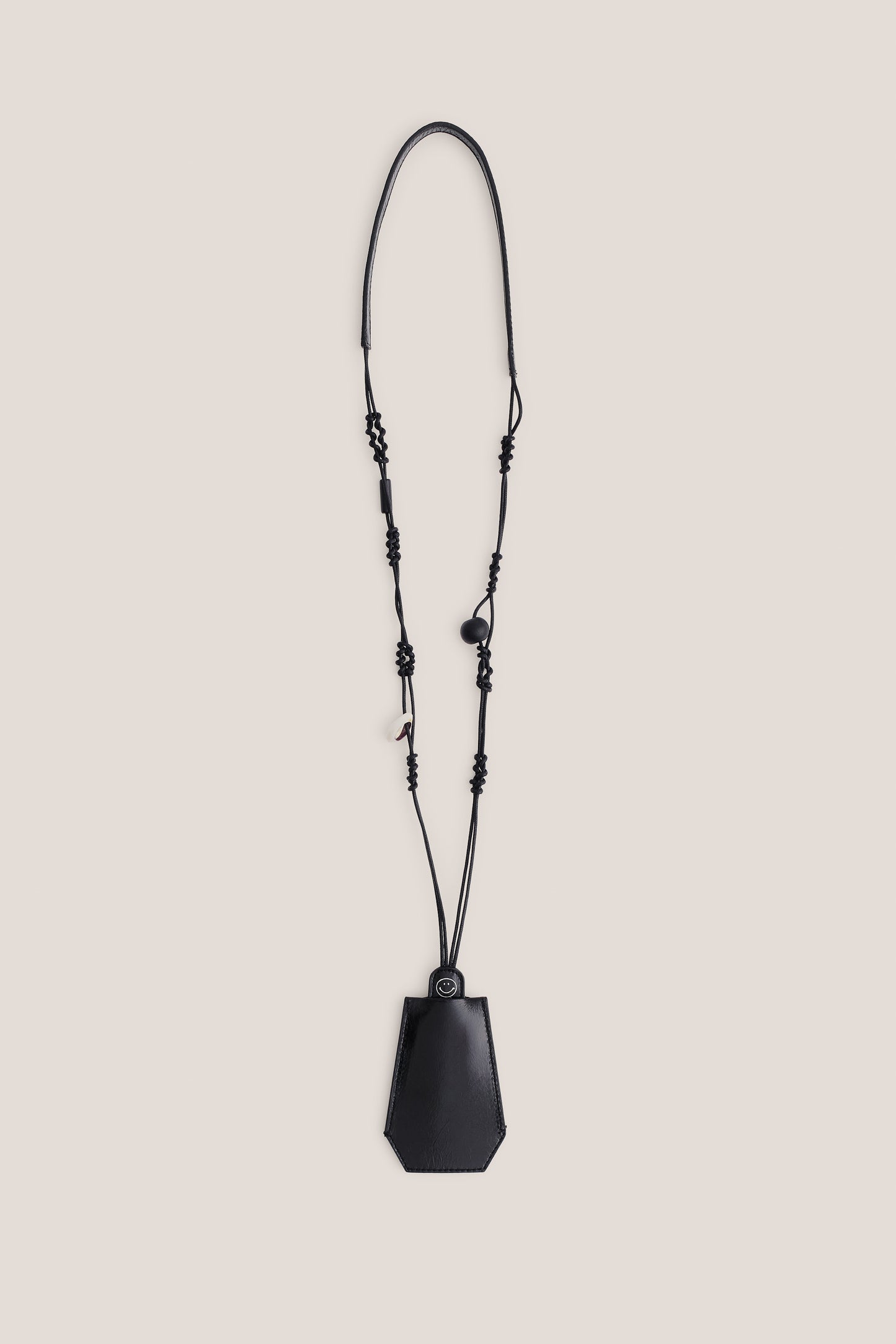 Unisex accessories keychain, black LWG-certified calf leather and cotton macramé strap with wooden and ceramic beads.