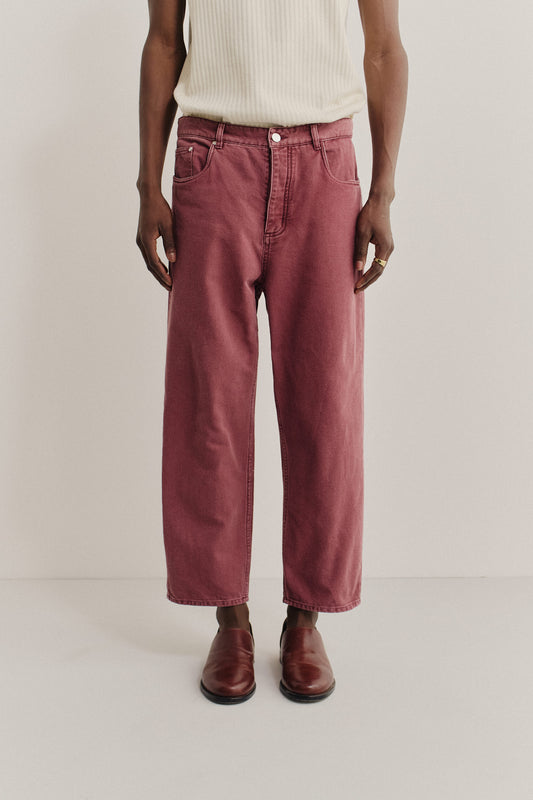 Men's long-pants, organic cotton, stone washed, red Terek Jeans with a loose fit and cropped length.