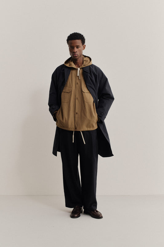 Men's outerwear jacket, cotton-linen seersucker, pinstriped brown Tsavo Jacket over a navy mac.