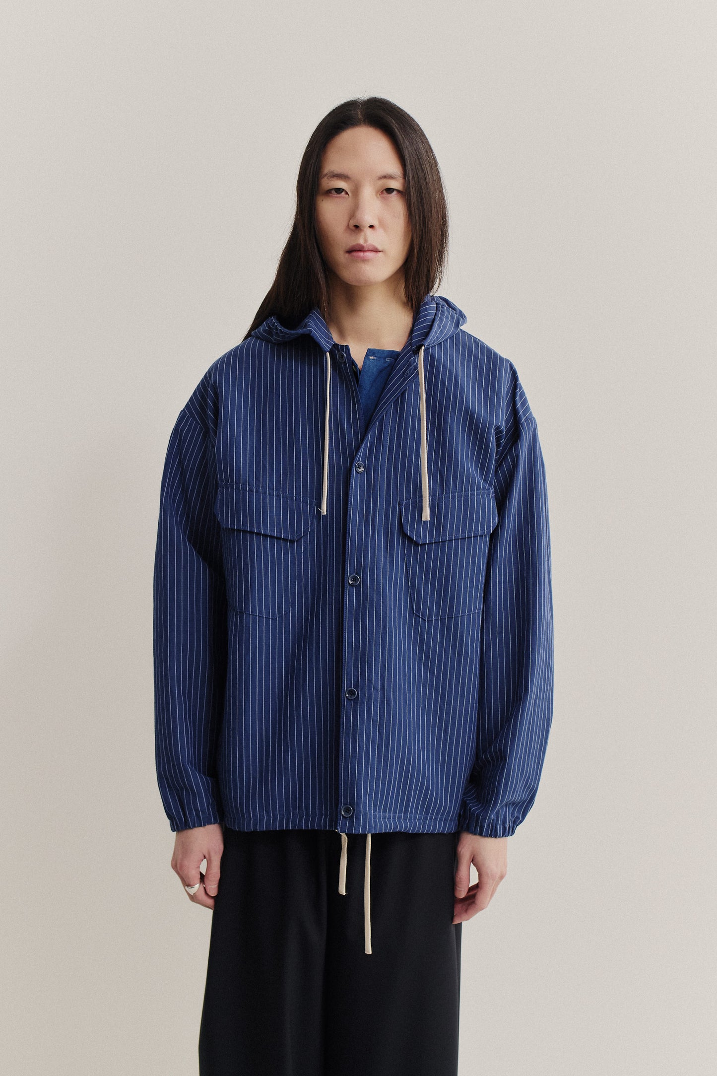 Men's outerwear jacket, cotton-linen seersucker, navy with pinstripes, adjustable hem, overcut shoulders.