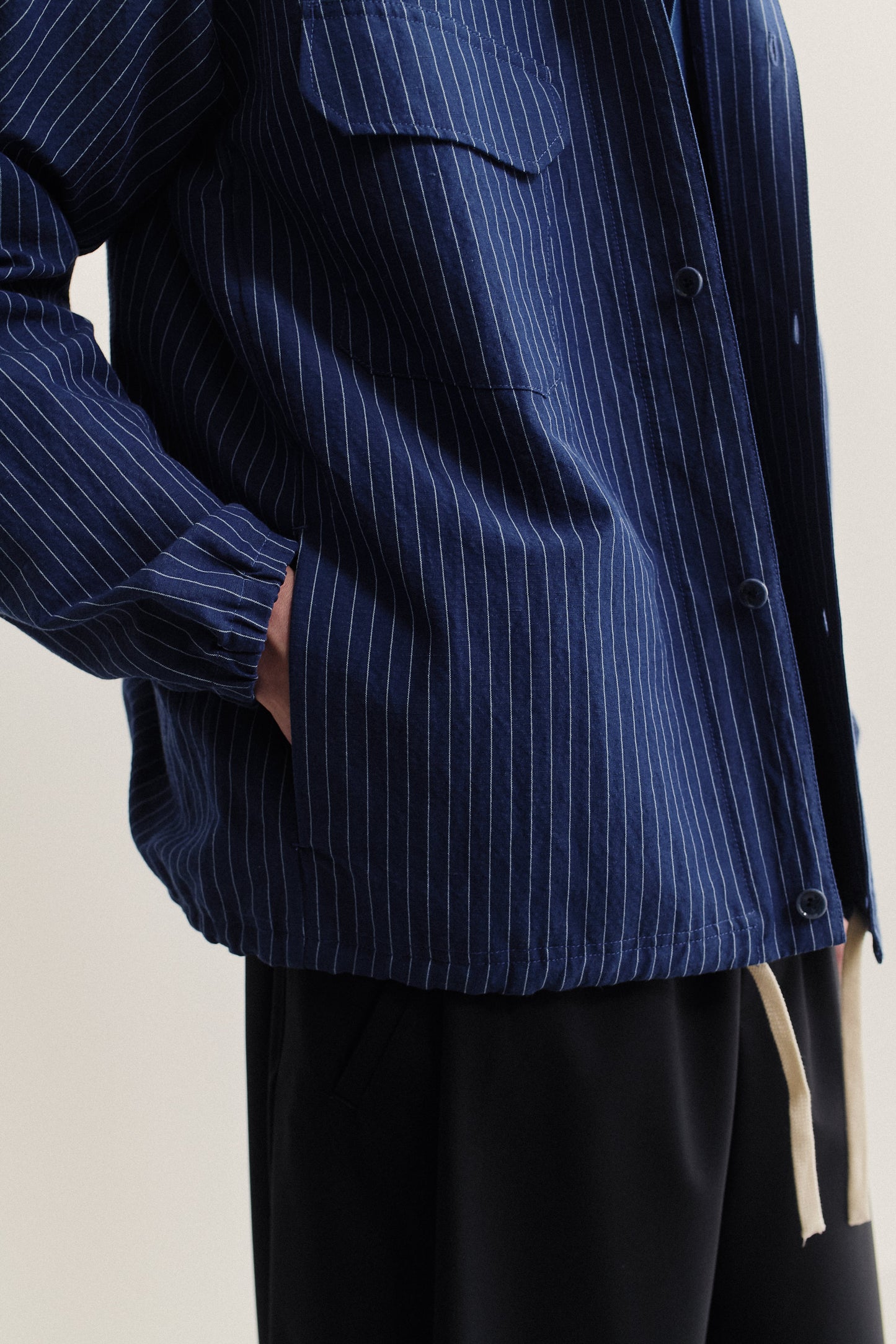 Men's outerwear jacket, cotton-linen seersucker, navy with pinstripes, adjustable hem.