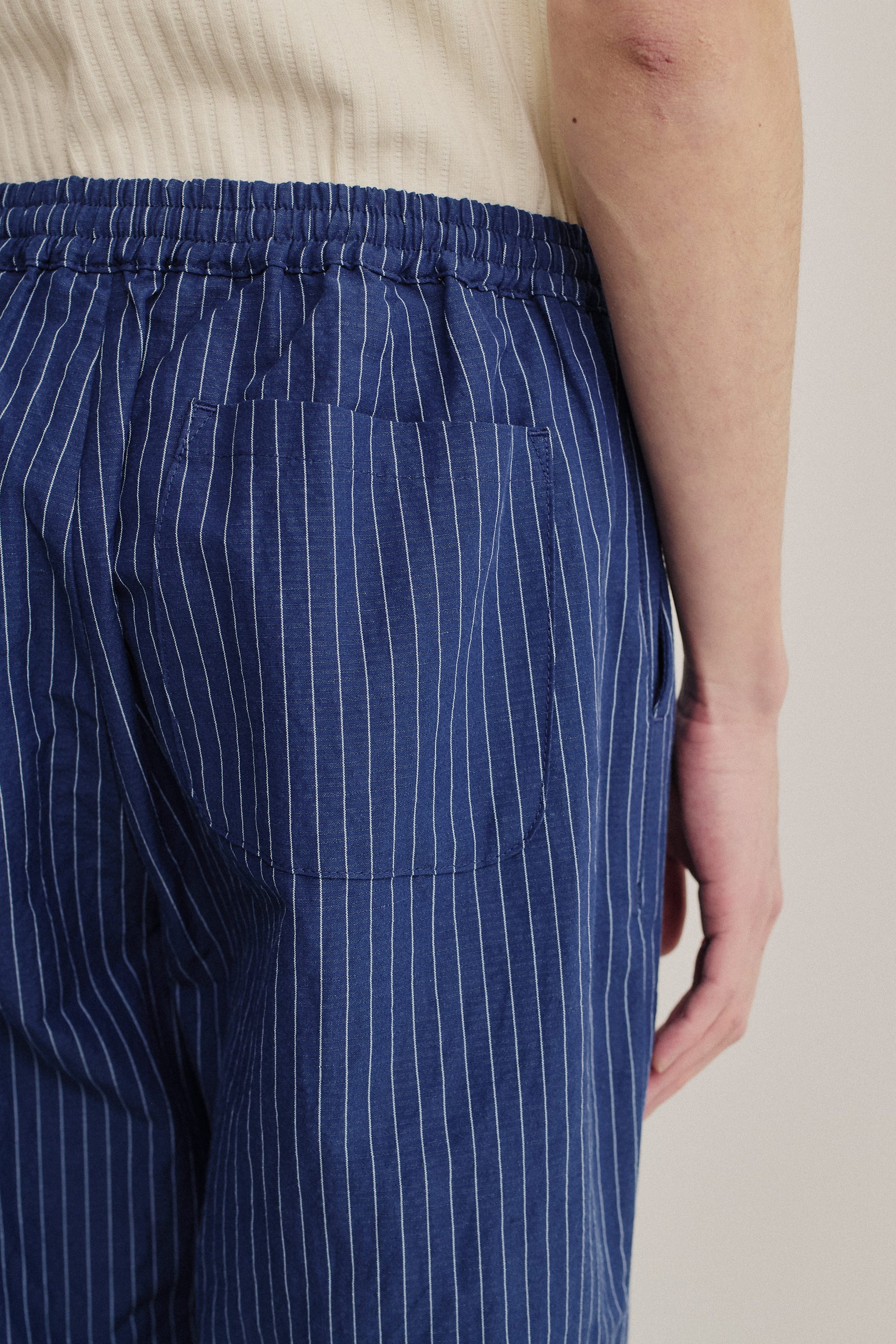 Men's long-pants, cotton-linen seersucker, navy with white pinstripes, elastic waist, back patch pocket.