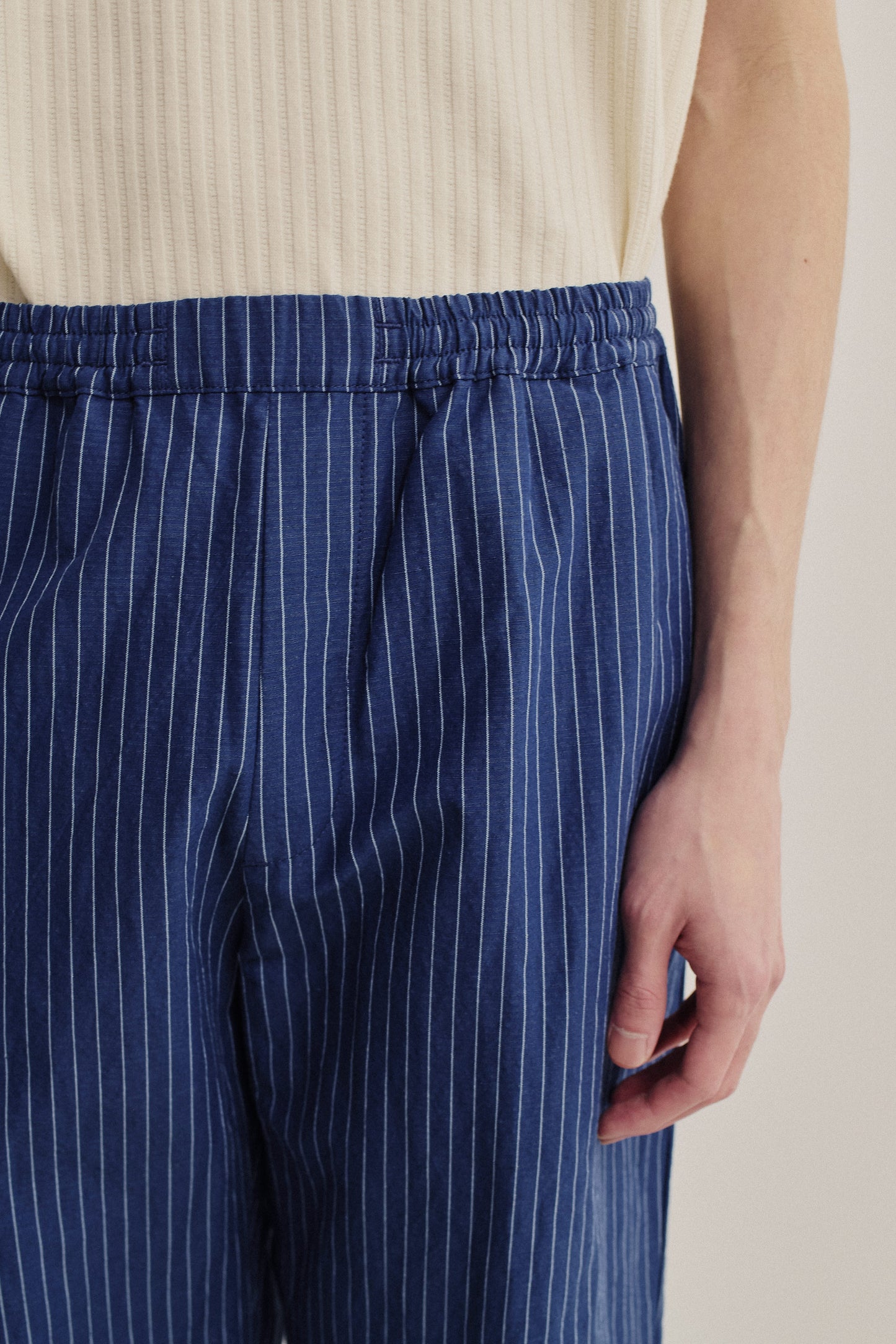 Men's long-pants, cotton-linen seersucker, navy with white pinstripes, elasticated waistband.