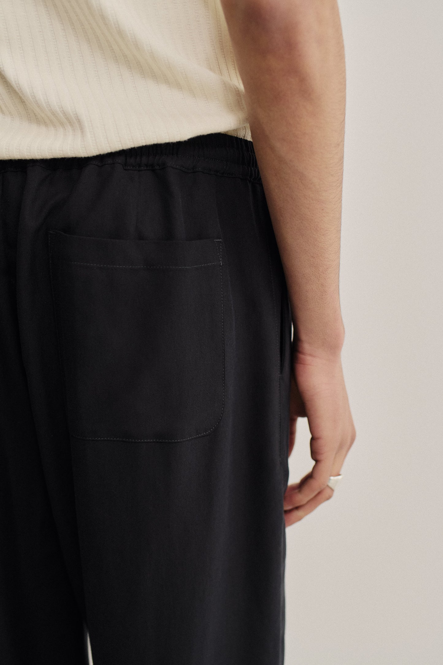 Men's long pants, lyocell heavy twill, deep black, elastic waist, back patch pocket.