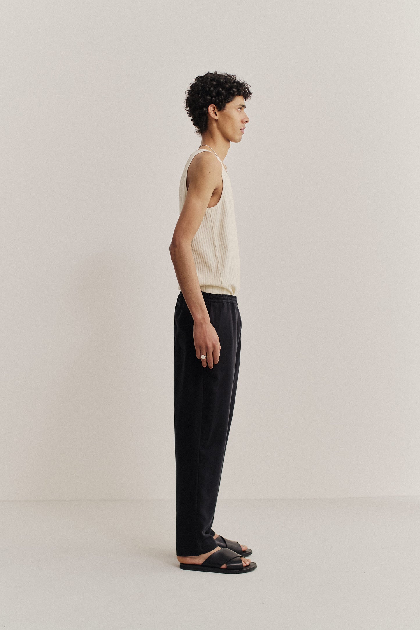 Men's long-pants, lyocell heavy twill, deep black, relaxed fit, tapered cropped leg, elasticated waist.