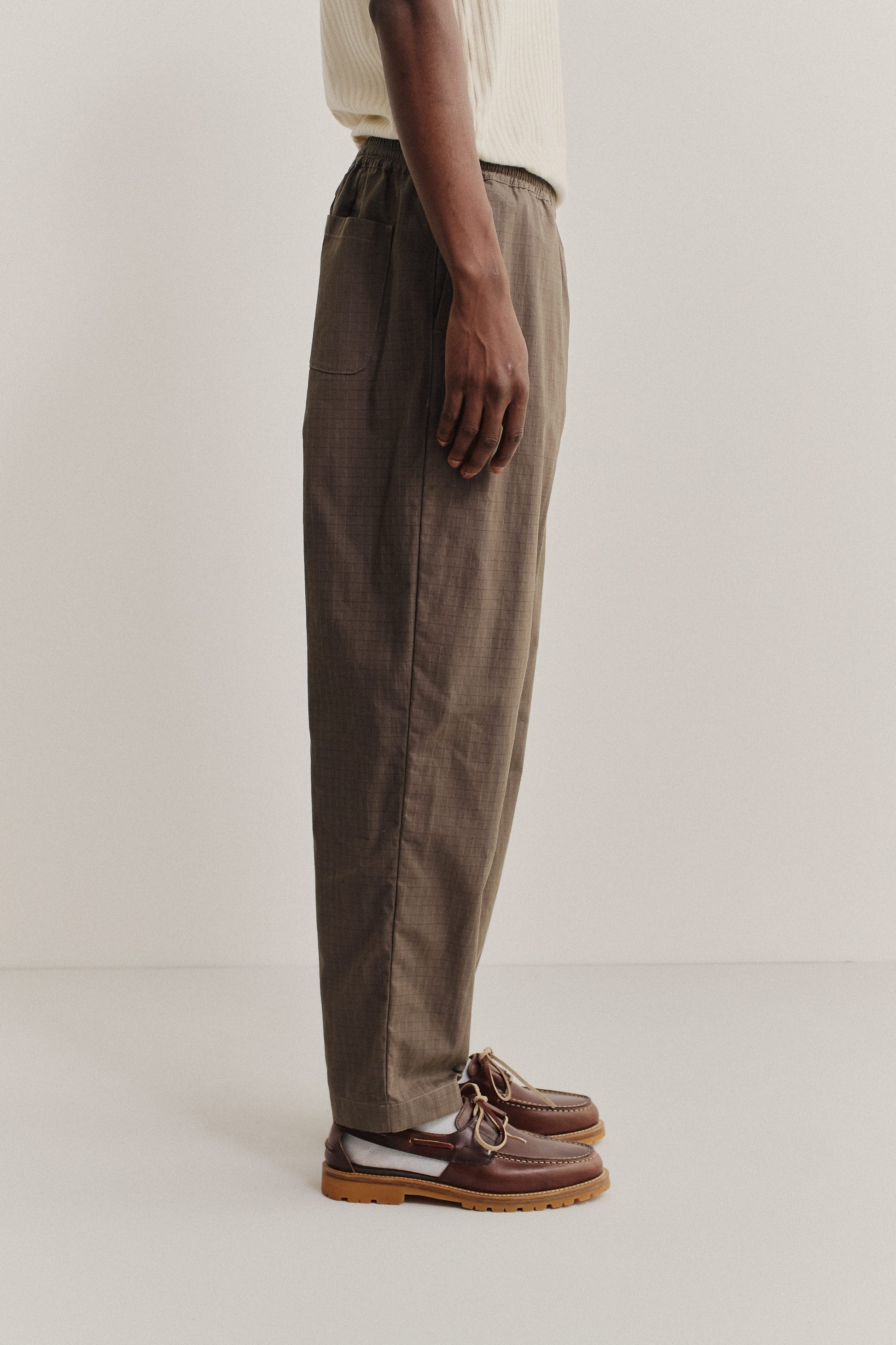Men's long-pants, cotton blend ripstop, brown, relaxed fit with elastic waist and cropped leg.