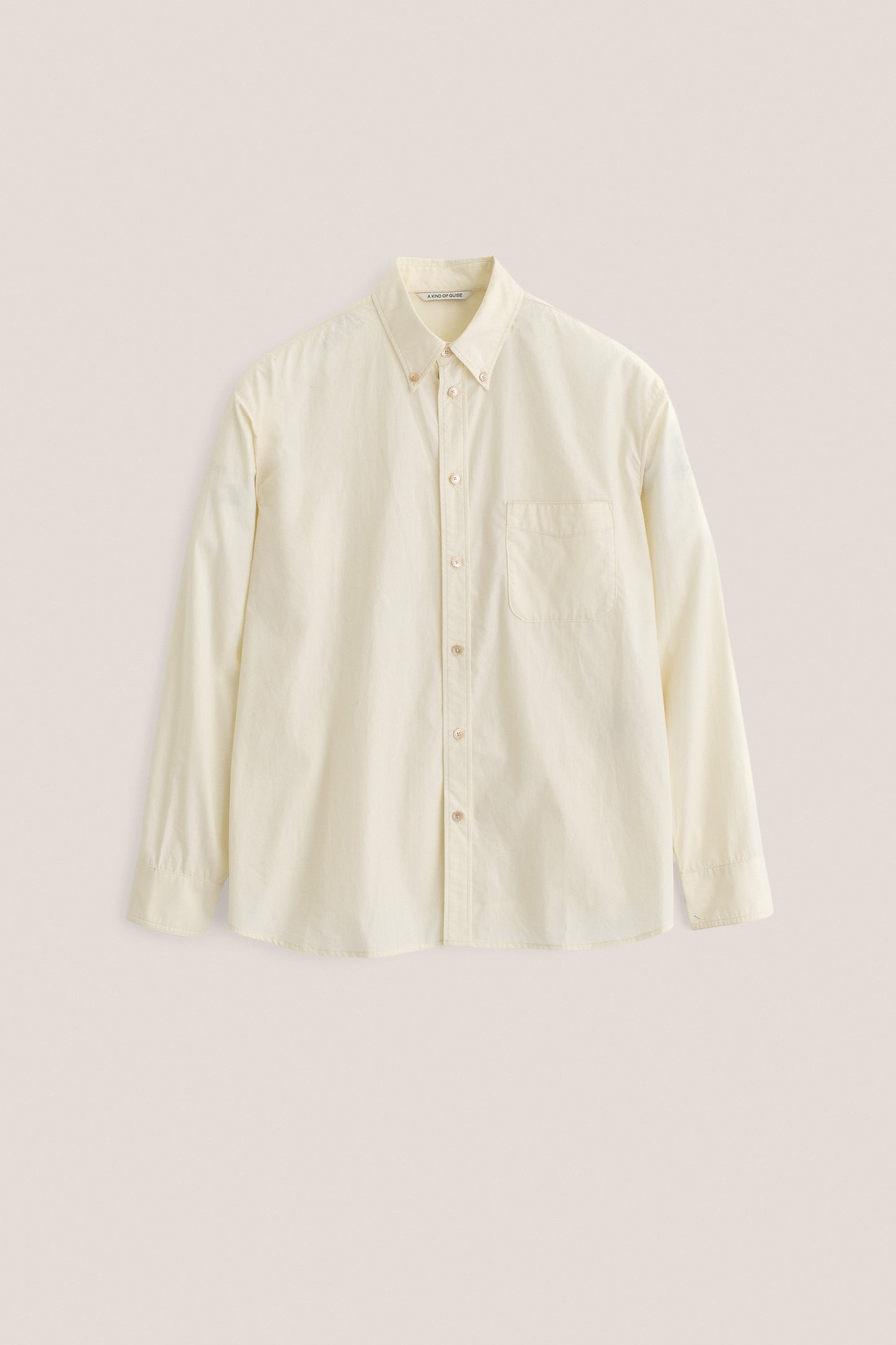 Men's long-sleeved shirt, organic cotton, garment washed, cream, with patch pocket and curved hem.
