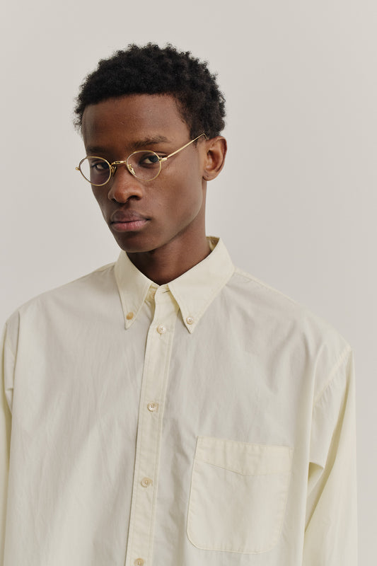 Men's long-sleeved shirt, organic cotton, garment washed, light yellow, with button-down collar and patch pocket.