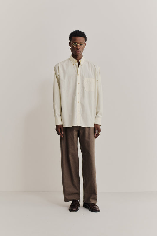 Men's long-sleeved shirt, organic cotton, garment washed, light yellow, oversized with patch pocket.