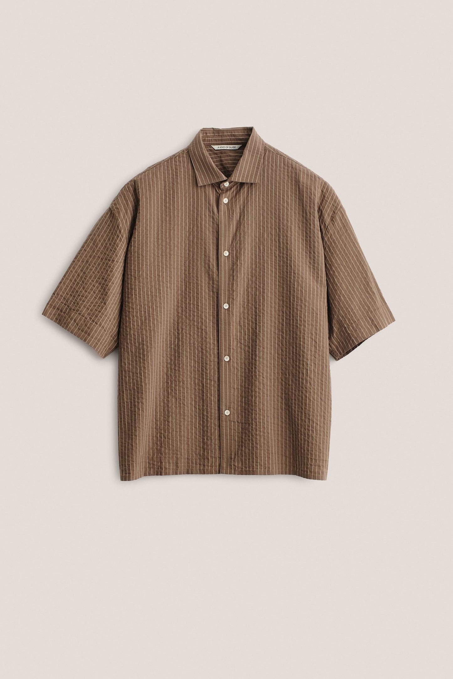 Men's short-sleeved shirt, organic cotton seersucker, cocoa brown with white stripes, boxy fit.