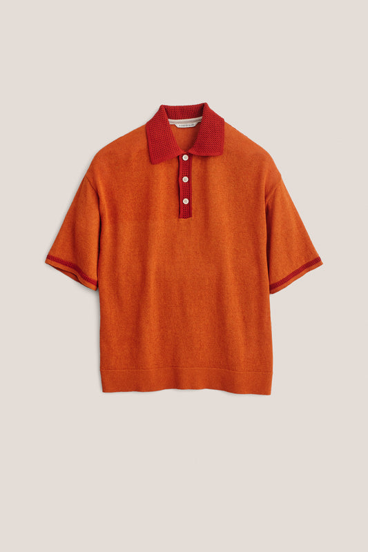 Men's knit short-sleeved polo, linen-organic cotton blend, orange with red contrast collar and sleeve stripe.