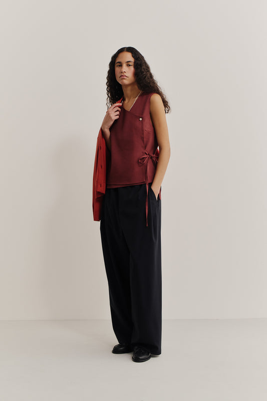 Women's sleeveless shirt, linen-wool-mohair blend, asymmetric wrap front, V-neck, button closure, adjustable side ties, terracotta.