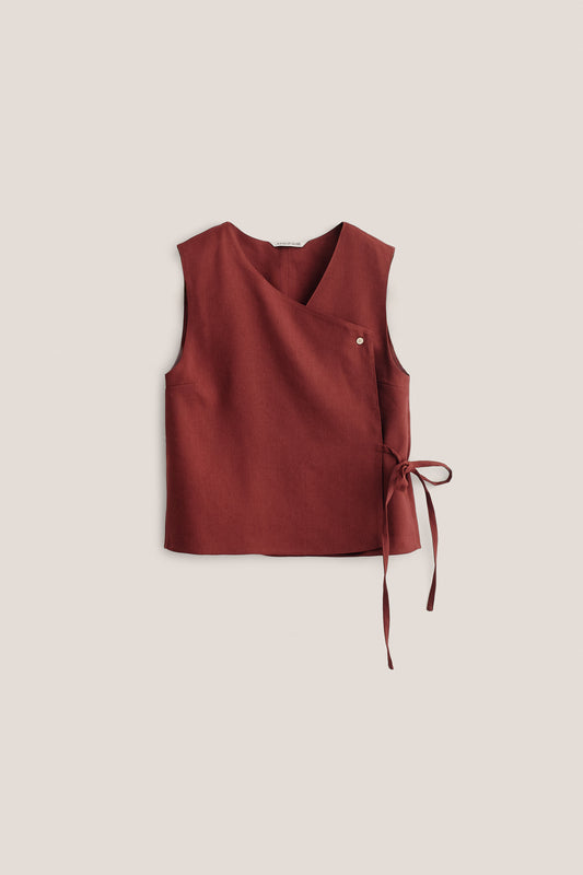 Women's sleeveless wrap shirt in linen, virgin wool, mohair blend, terracotta, with V-neck and side ties.