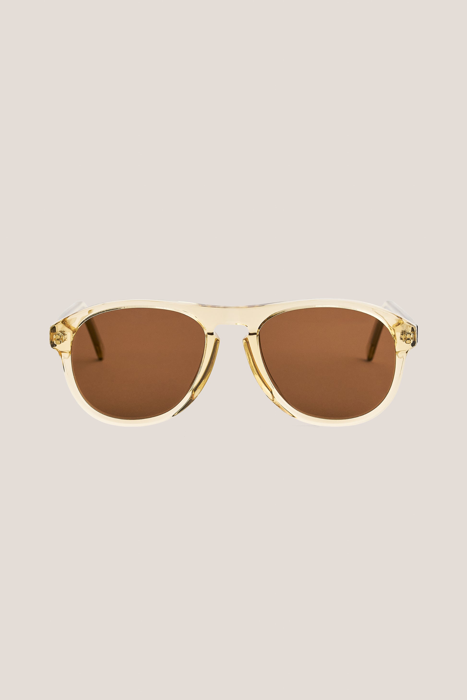Unisex accessories sunglasses, handcrafted clear acetate aviator frames with brown Carl Zeiss lenses.