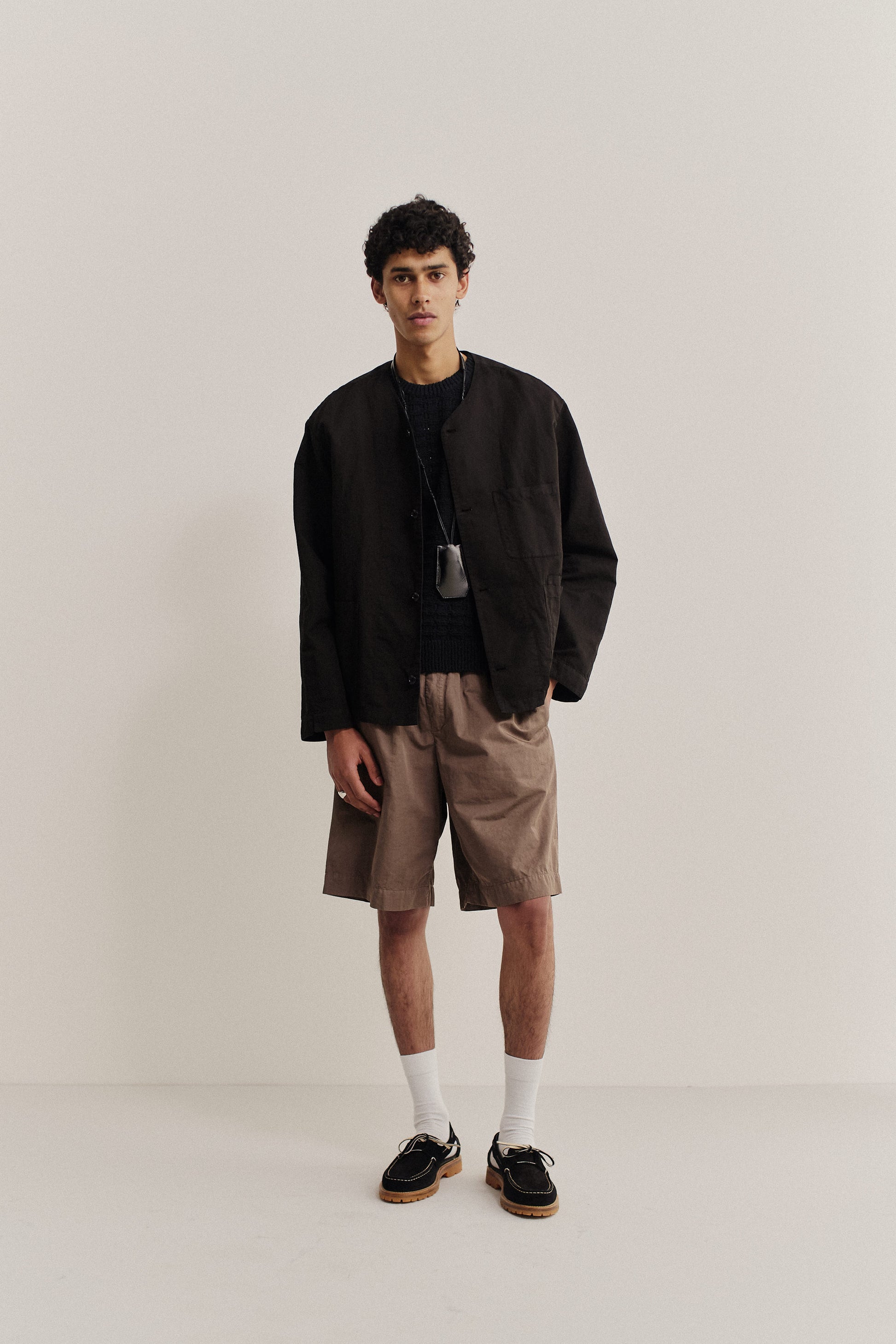 Men's long-sleeved overshirt, linen-cotton blend, garment-dyed black, with patch pockets.