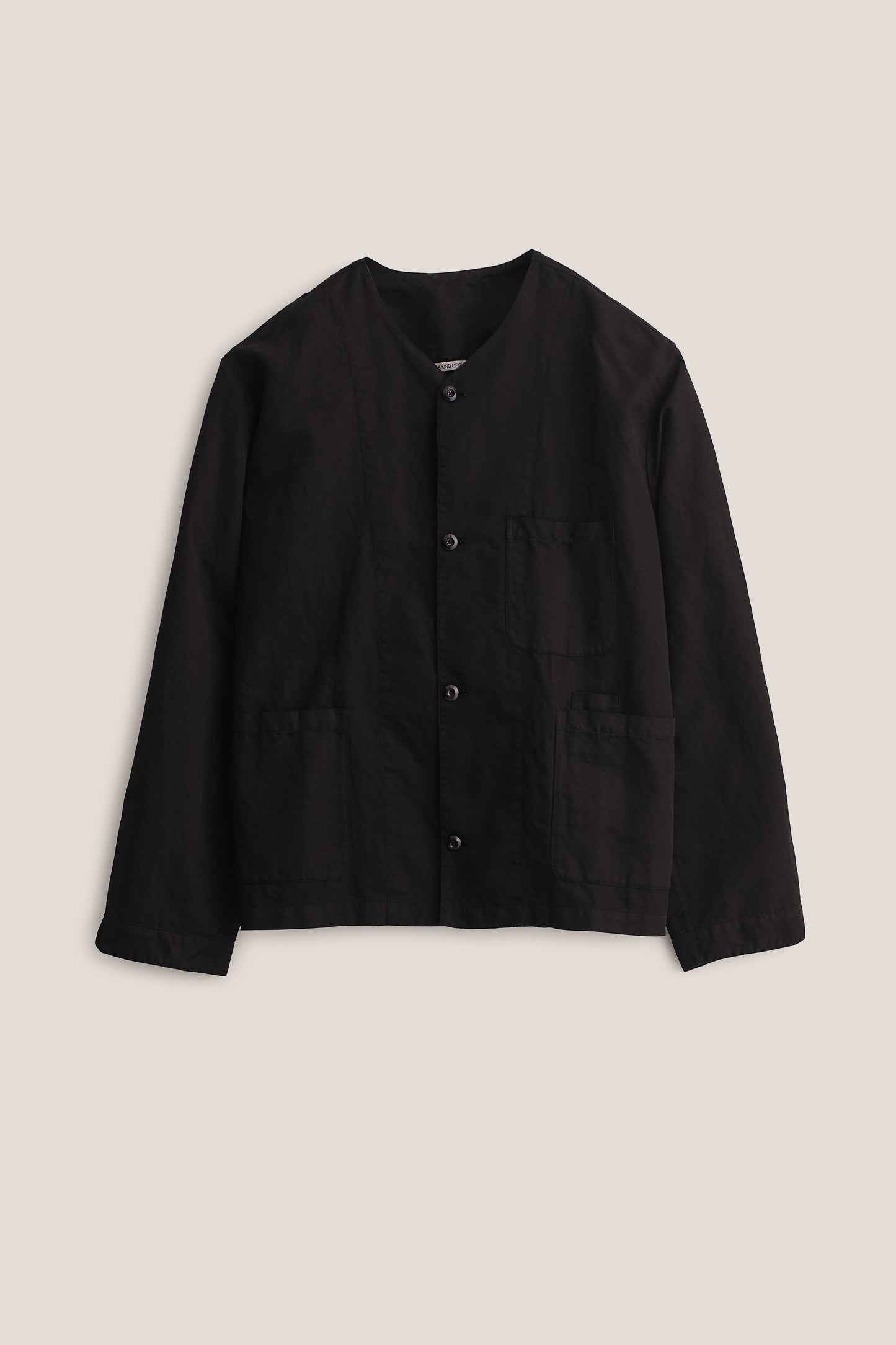 Men's long-sleeved overshirt, linen-cotton blend, garment-dyed black, with v-neck and patch pockets.