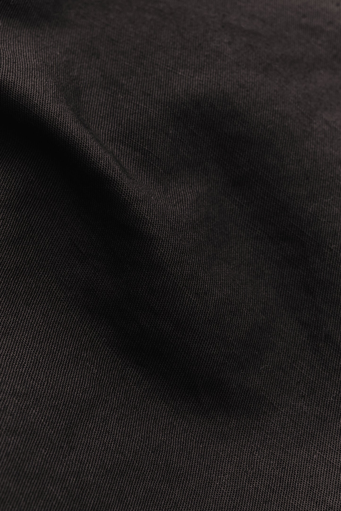 Men's long-sleeved overshirt, linen and cotton blend, garment-dyed deep black, structured weave.