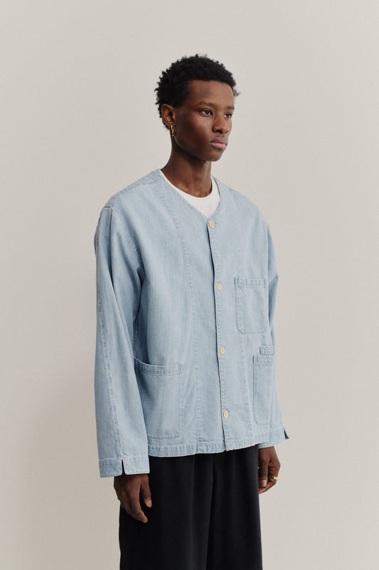Men's long-sleeved overshirt, light blue organic cotton-silk blend denim, v-neck, patch pockets.