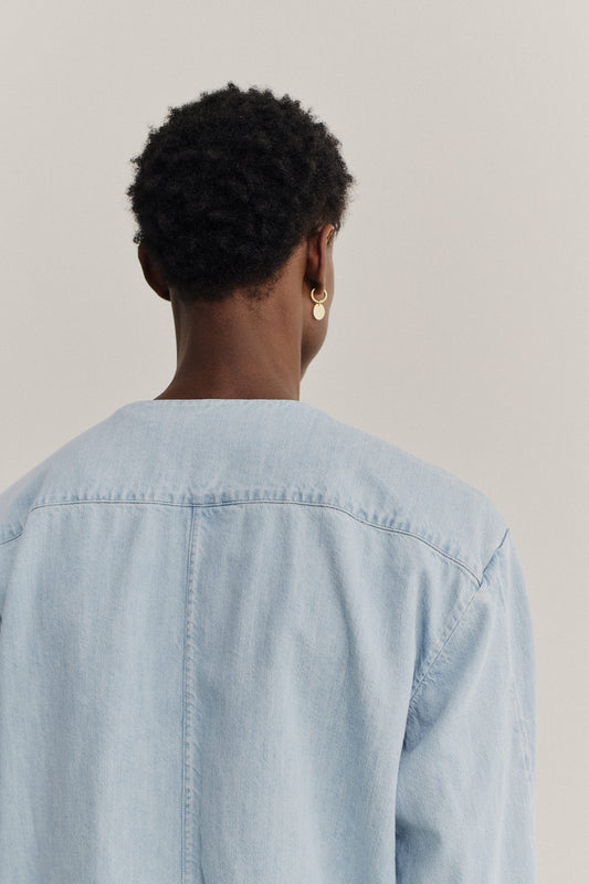 Men's long-sleeved overshirt, light blue organic cotton-silk denim with dropped shoulders and v-neck.