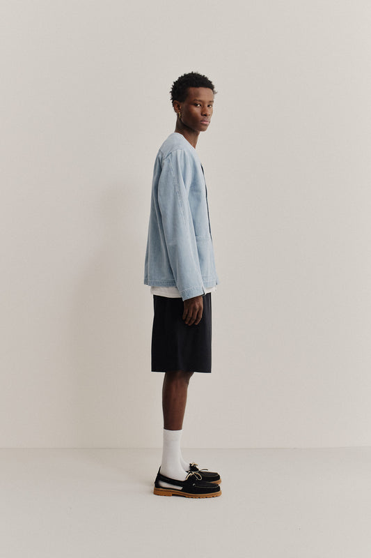 Men's long-sleeved overshirt, light blue organic cotton-silk denim, boxy fit, dropped shoulder, patch pockets.