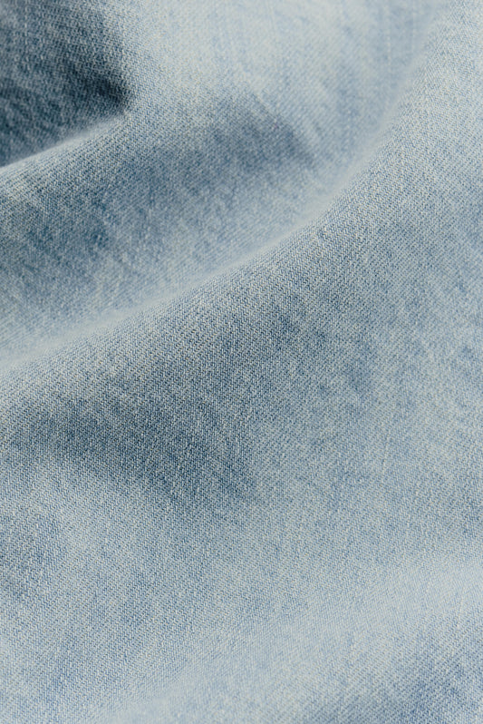 Men's long-sleeved overshirt, light blue organic cotton-silk denim with vintage texture.