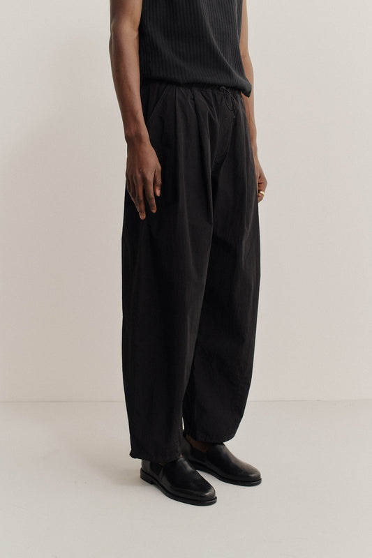 Men's long-pants, recycled nylon and cotton blend, black, relaxed fit, elastic waist, ankle length.