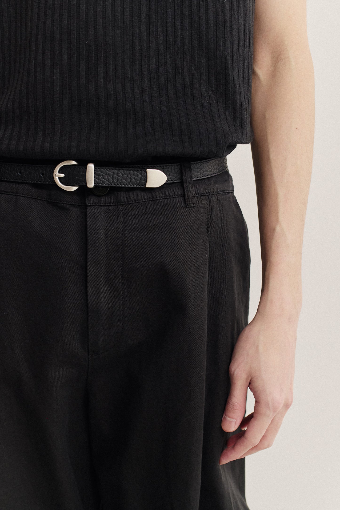 Men's accessories belt, black grainy calf leather with silver-tone buckle.