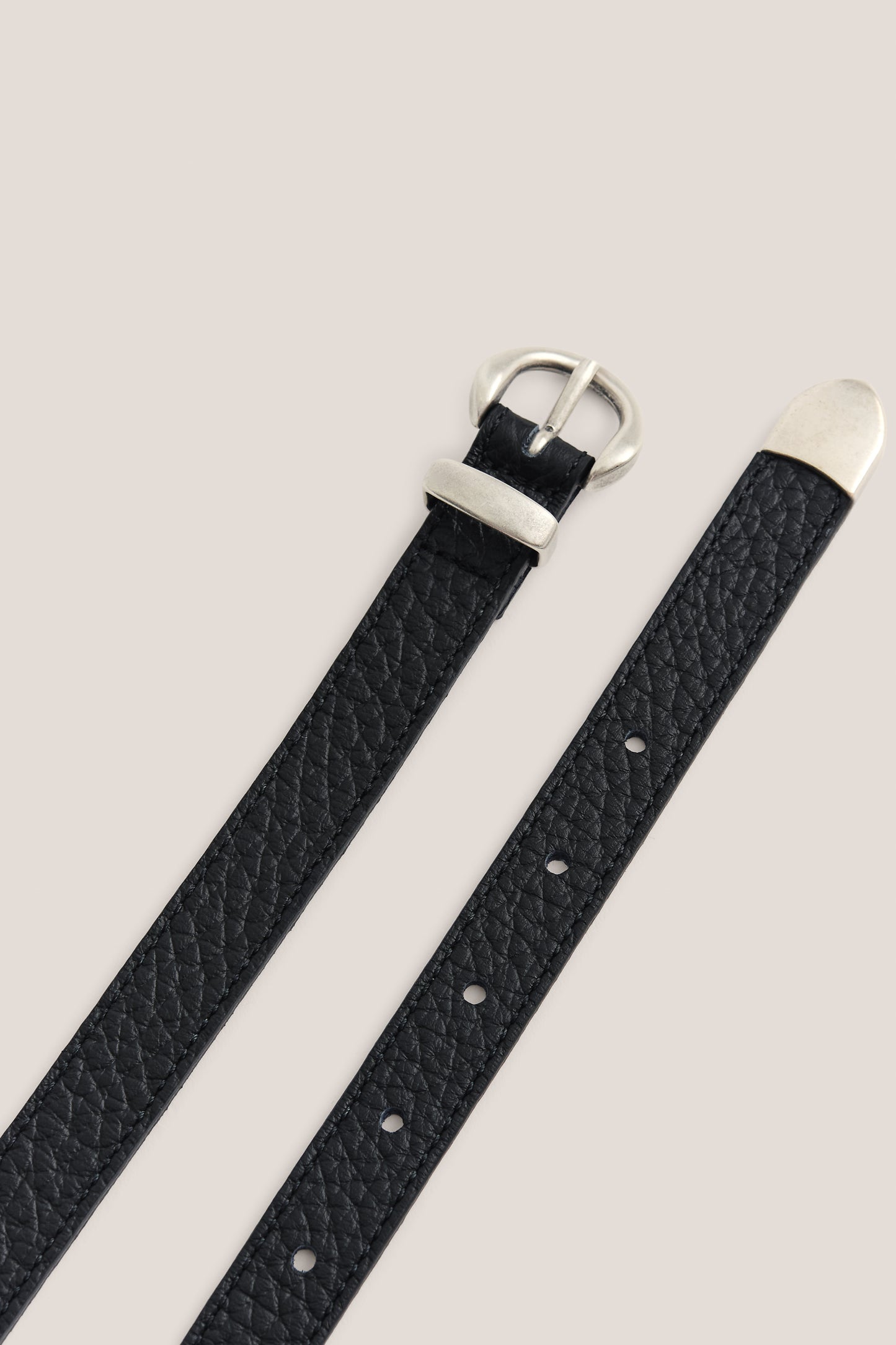 Men's accessories belt, black grainy calf leather with a silver buckle and tip.