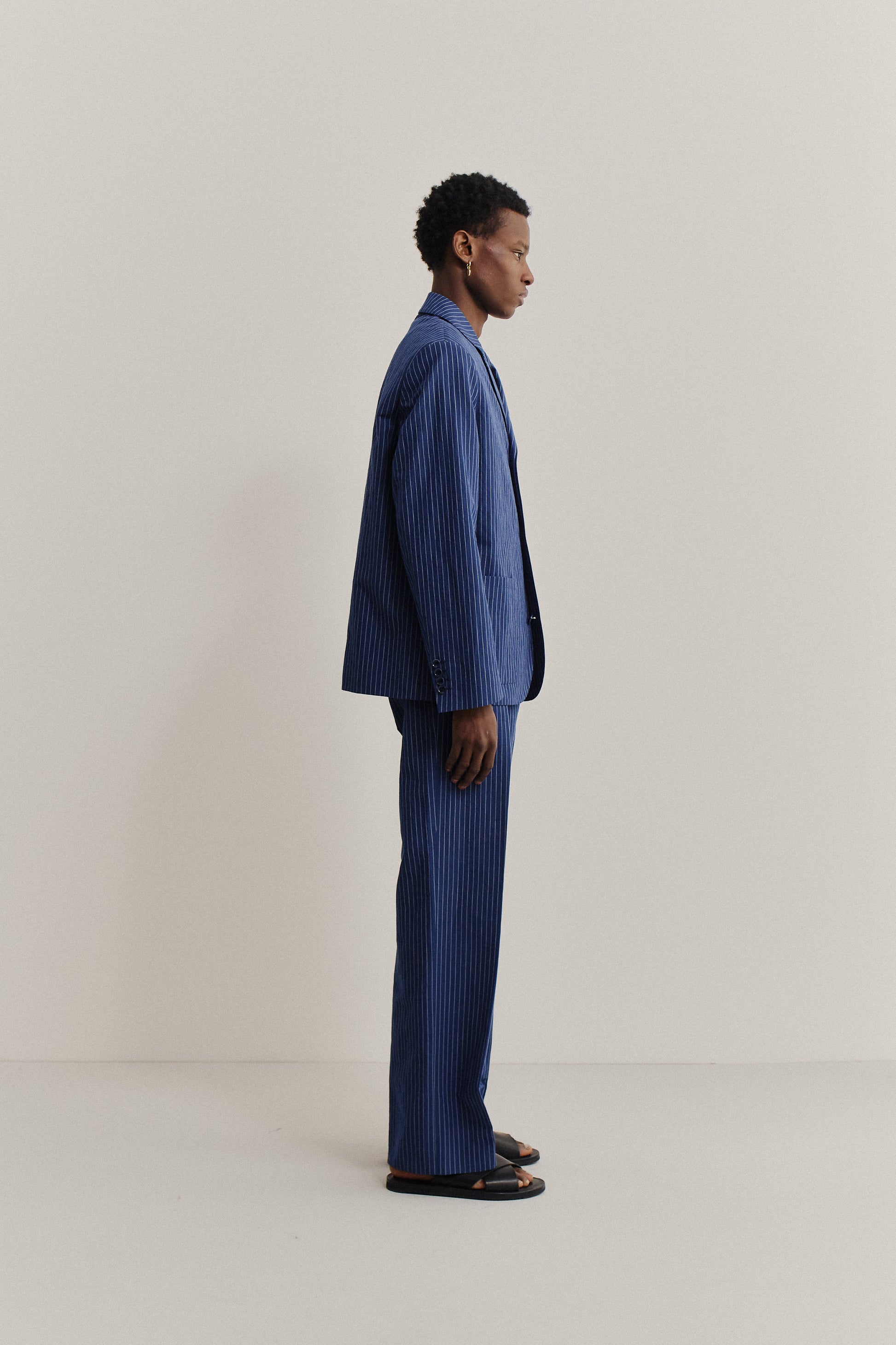 Men's tailoring, cotton-linen seersucker Deconstructed Atelier Blazer and matching pants in ocean stripe.