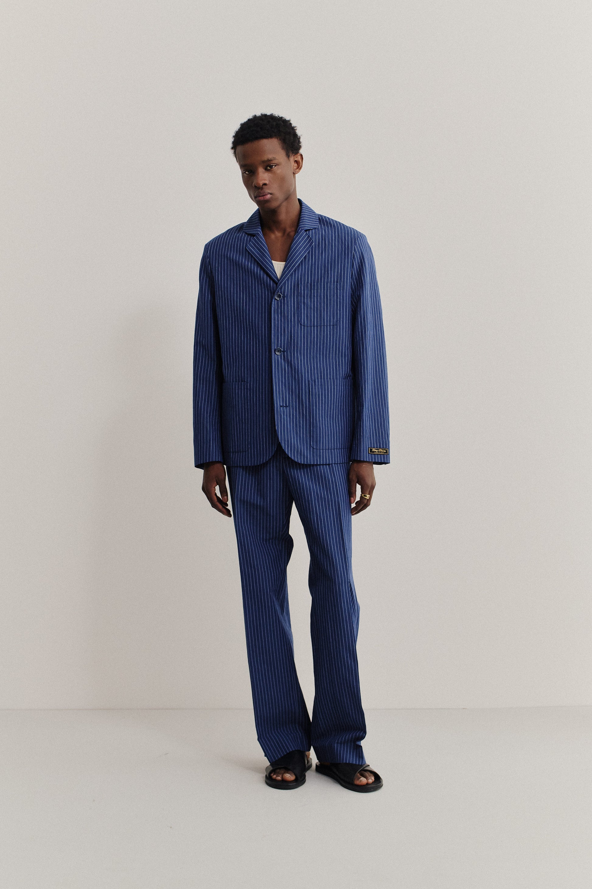 Men's tailoring, cotton-linen seersucker, ocean stripe Deconstructed Atelier Blazer with rounded lapel and patch pockets.