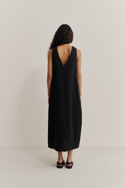 Women's dress, black worsted wool and linen blend, oversized O-shaped silhouette, deep V-neckline at back.