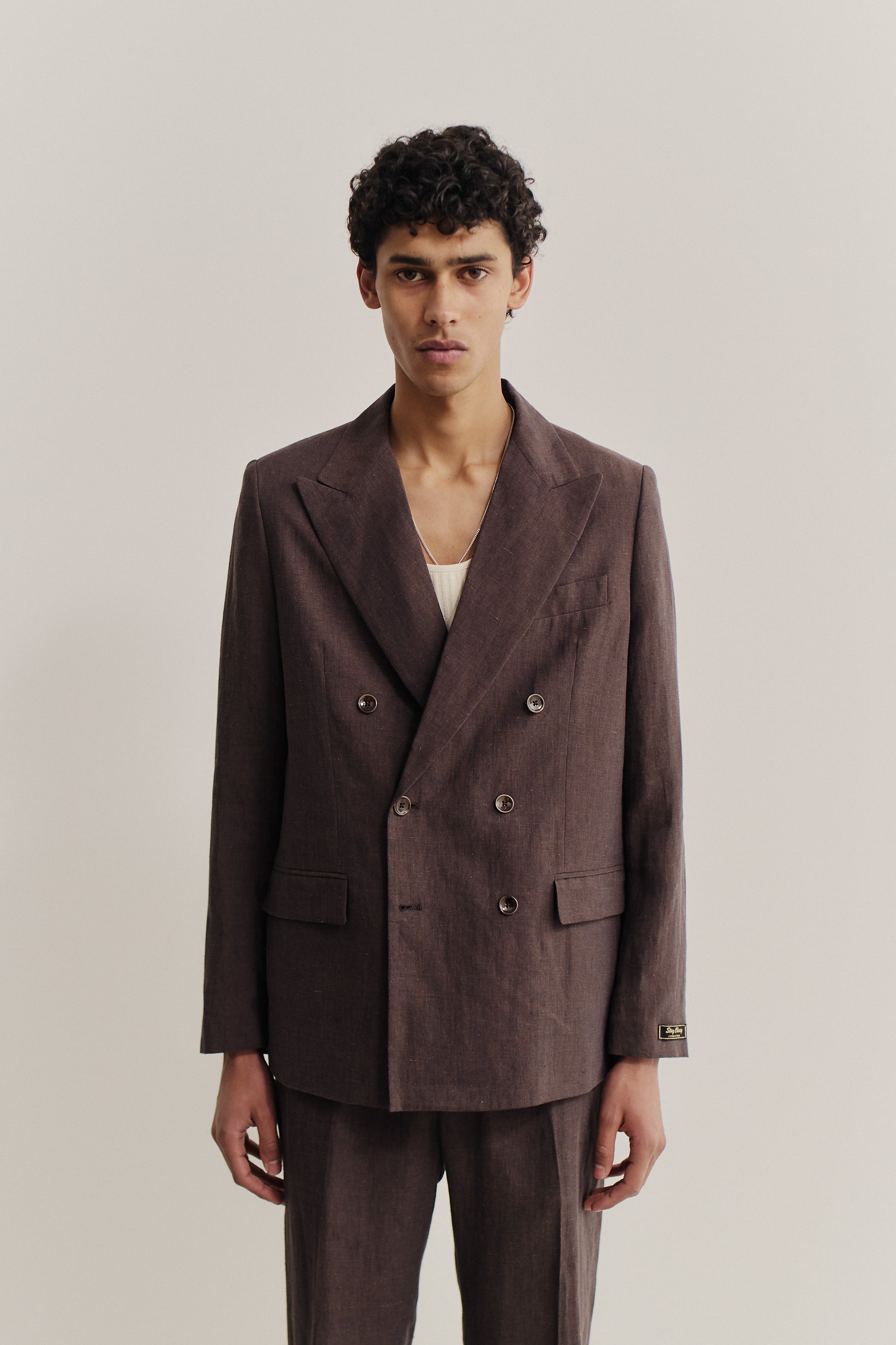 Men's tailoring, double-breasted peak blazer, 100% linen, brown, with wide peaked lapel.