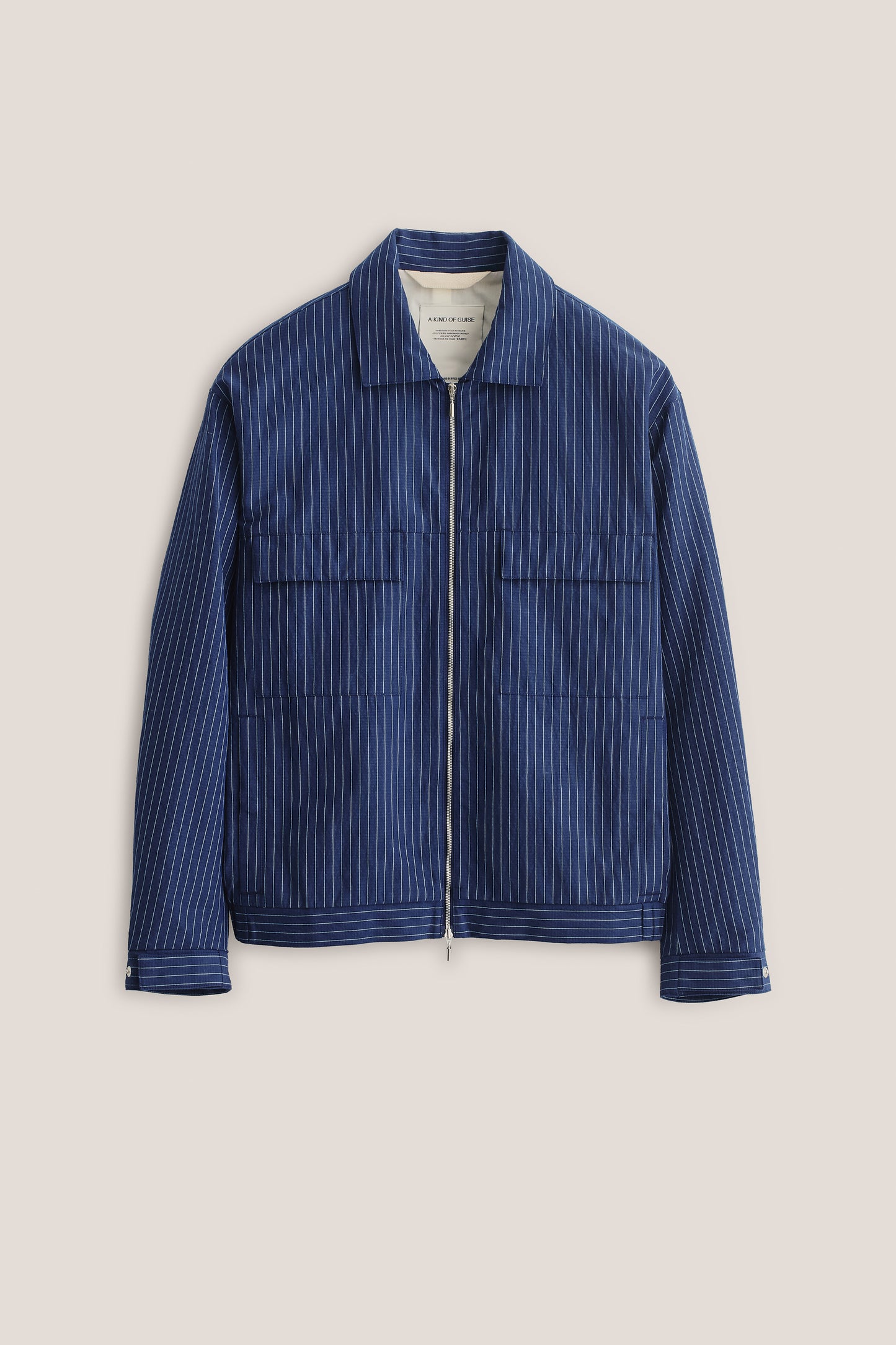 Men's outerwear jacket, cotton-linen seersucker, navy with pinstripes, boxy fit, flap chest pockets, front zip.
