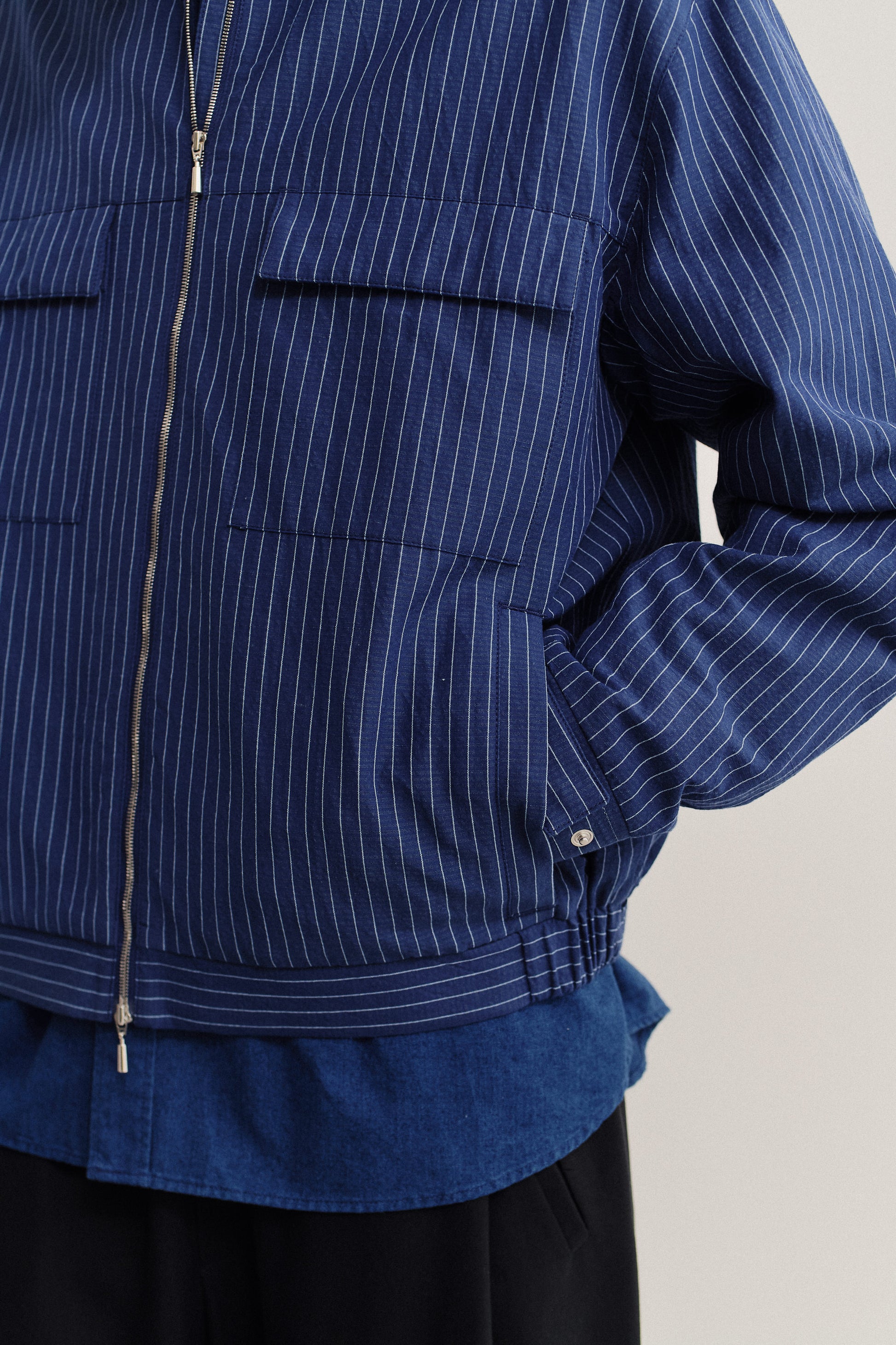 Men's outerwear jacket, cotton-linen seersucker, navy with pinstripes, zip closure, flap chest pockets.