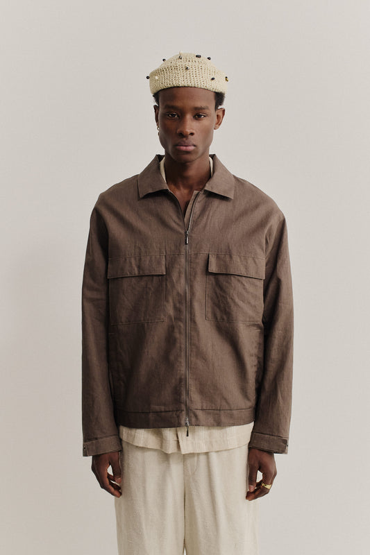 Men's outerwear jacket, 100% linen, natural brown, with flap chest pockets and front zip closure.