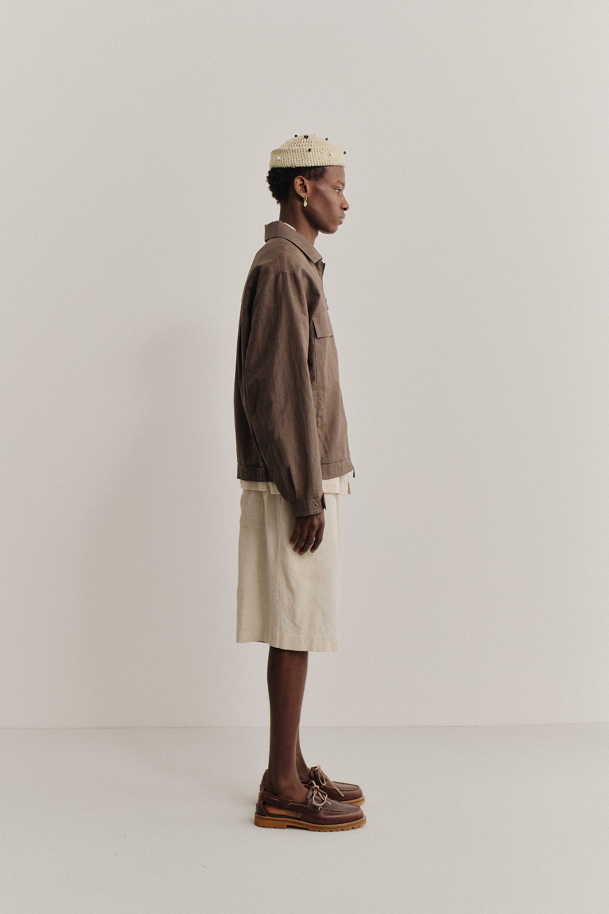 Men's outerwear jacket, 100% linen, natural brown, boxy silhouette, flap chest pockets, elasticated waist.