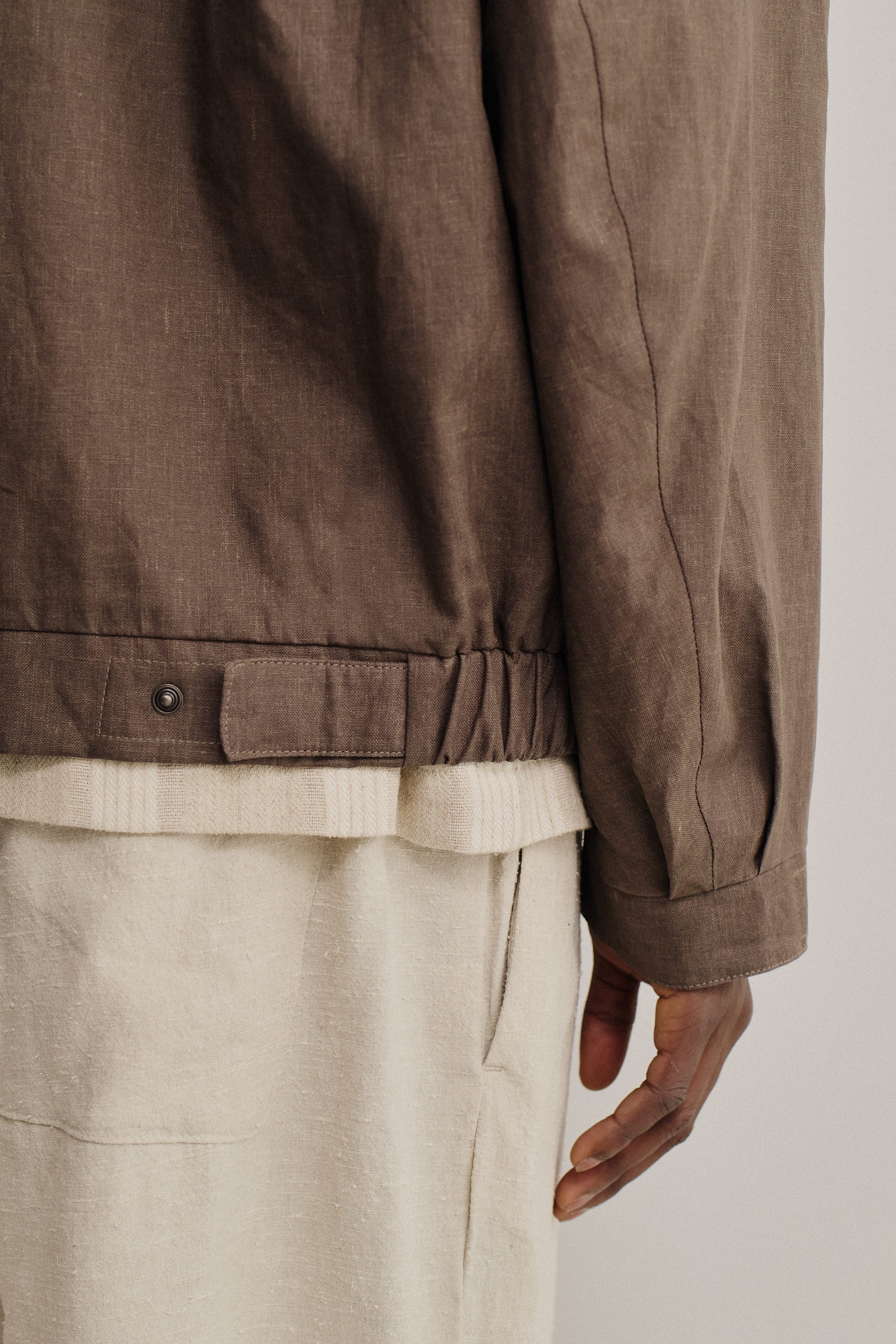 Men's outerwear jacket, 100% linen, natural brown, with elasticated waist and flap chest pockets.