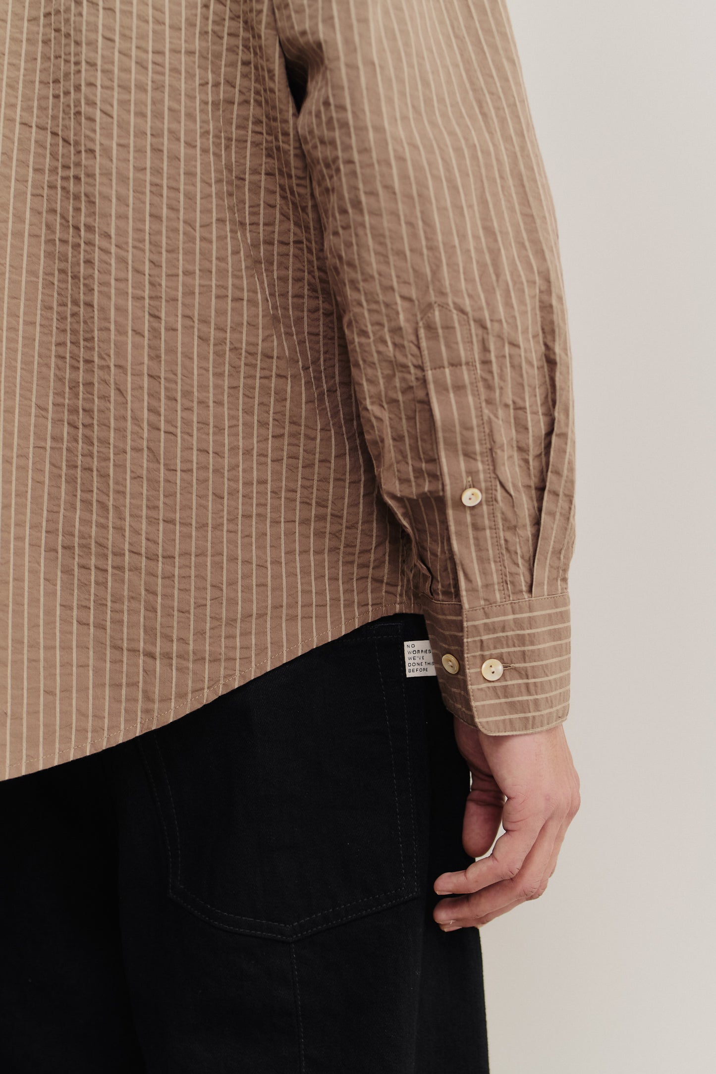 Men's long-sleeved shirt, organic cotton seersucker, cocoa brown stripes, mother-of-pearl buttons.