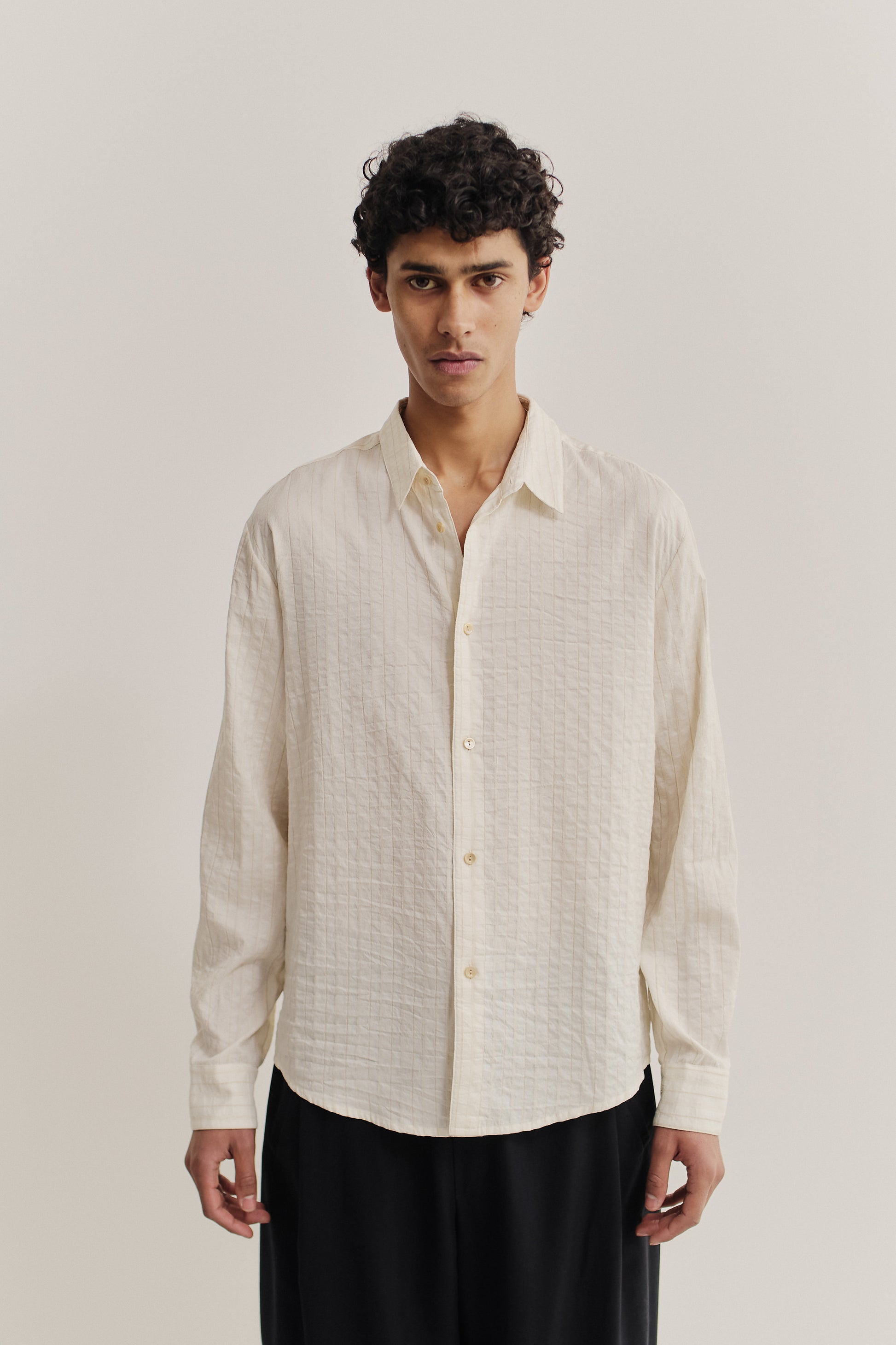 Men's long-sleeved shirt, cotton-silk-linen blend, washed, off-white with subtle textured stripes.