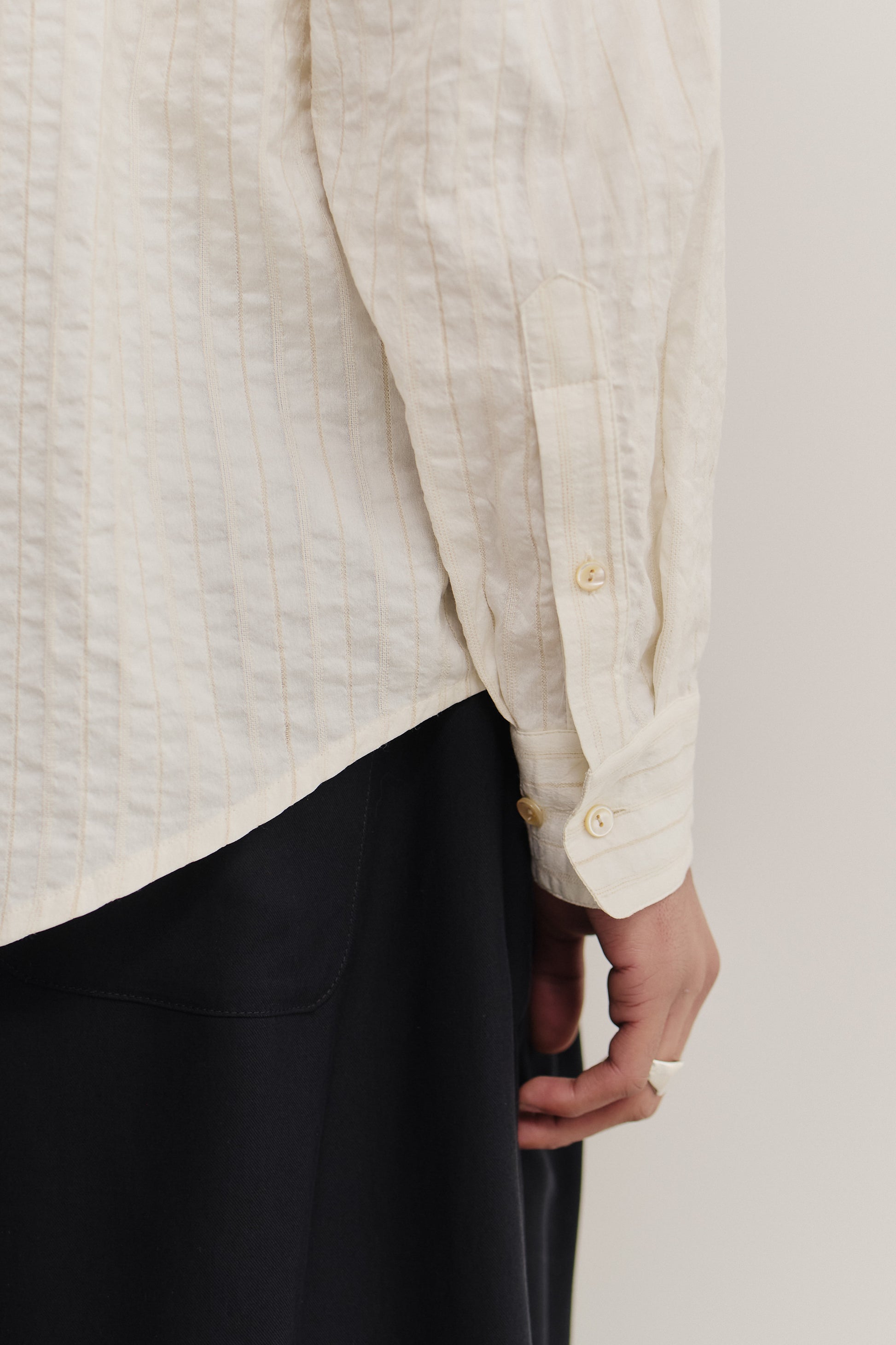 Men's long-sleeved shirt, cotton-silk-linen blend, washed, off-white with subtle stripes.