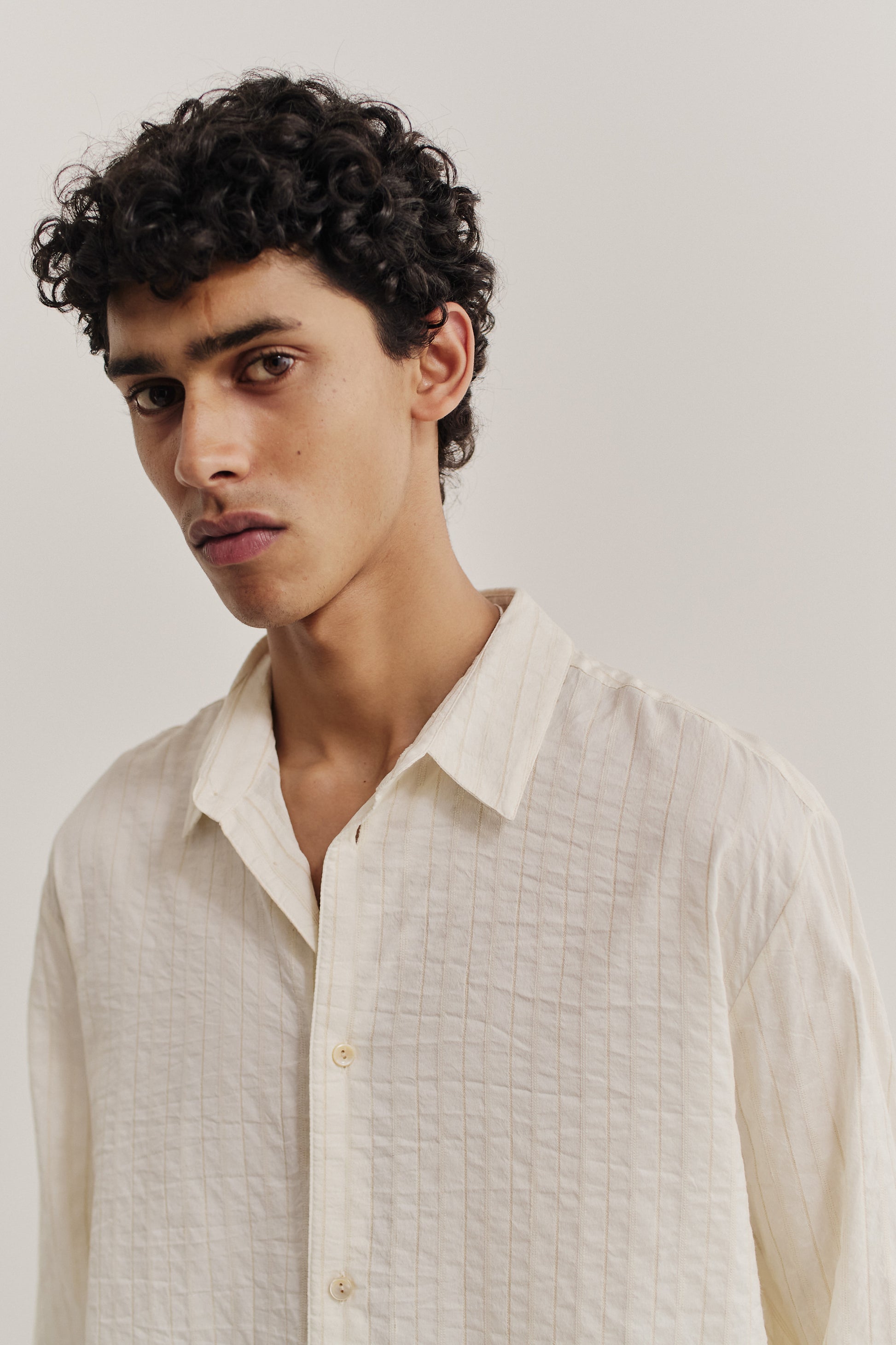Men's long-sleeved shirt, cotton silk linen mix, washed, off-white with subtle striped texture.