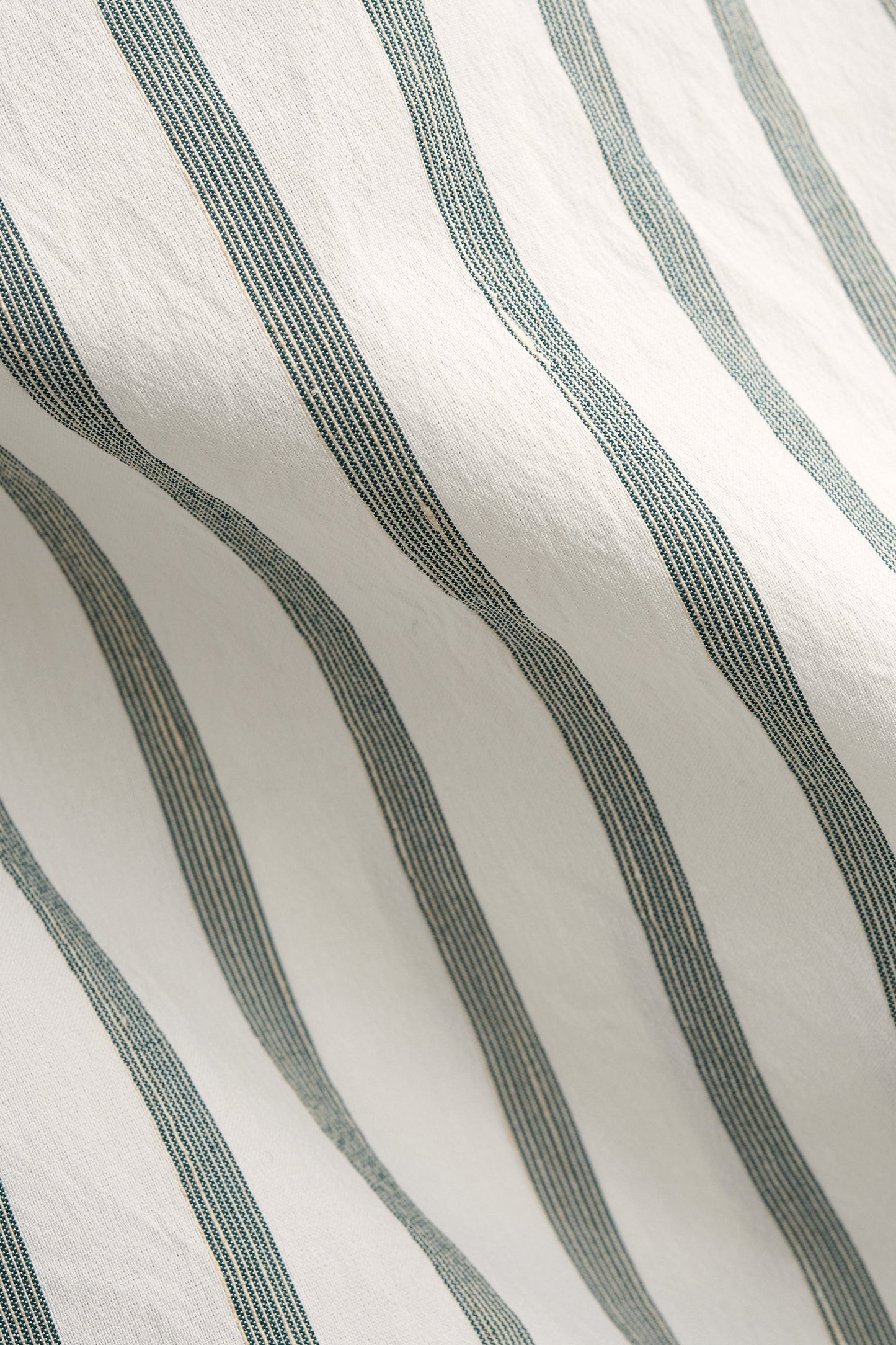 Men's long-sleeved shirt, cotton-silk-linen blend, washed white with fine green stripes.