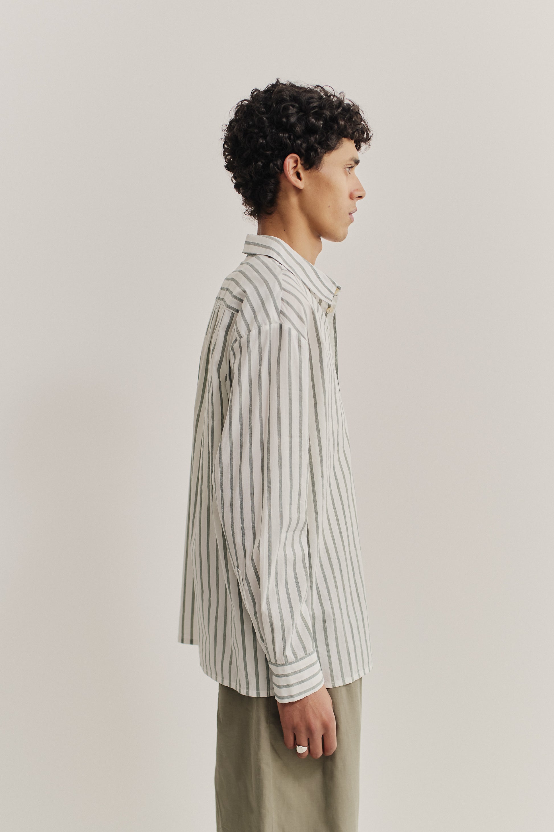 Men's long-sleeved shirt, cotton-silk-linen blend, washed finish, white with subtle grey stripes.